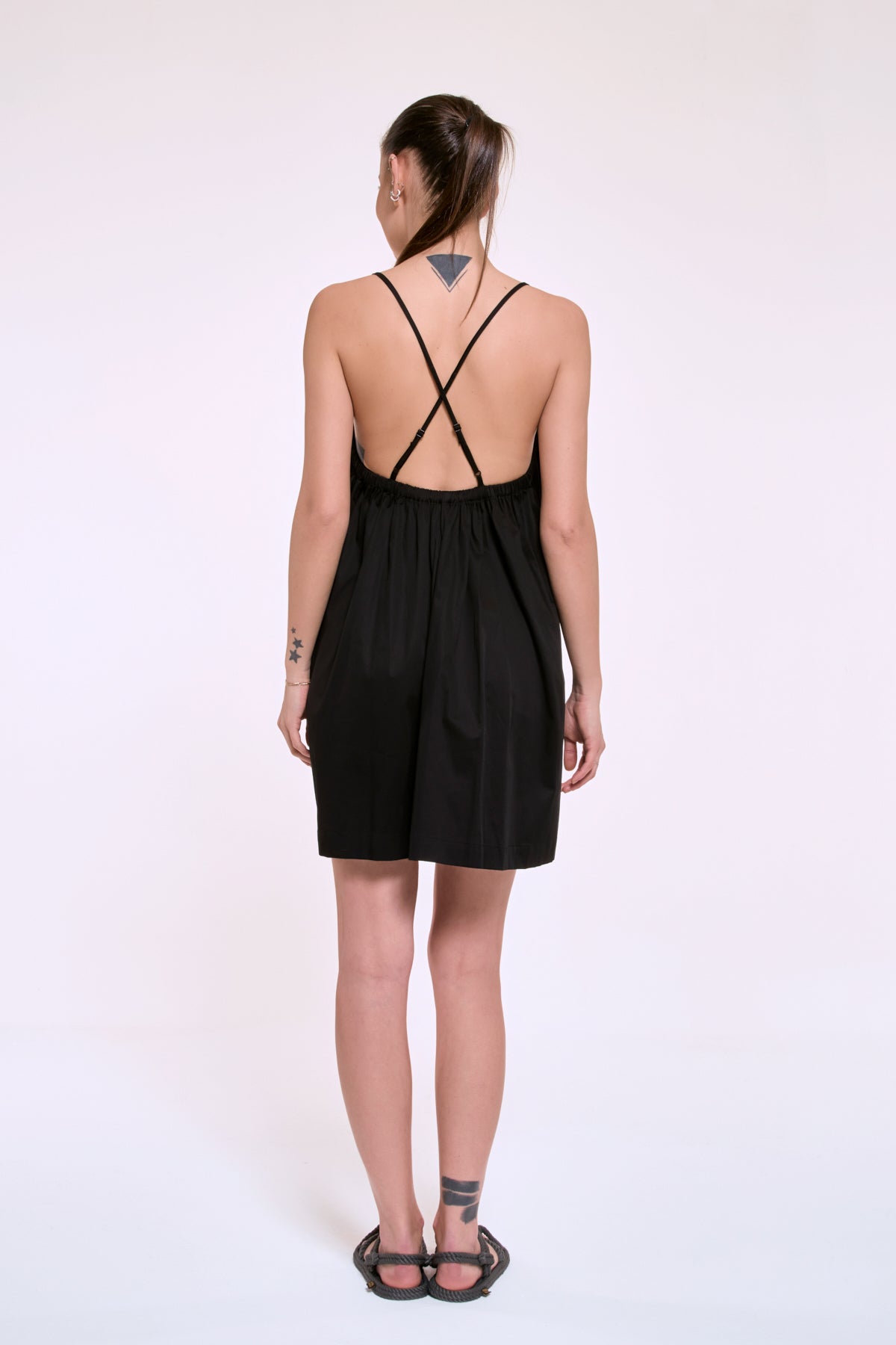 Daisy black mini dress with open back and thin straps