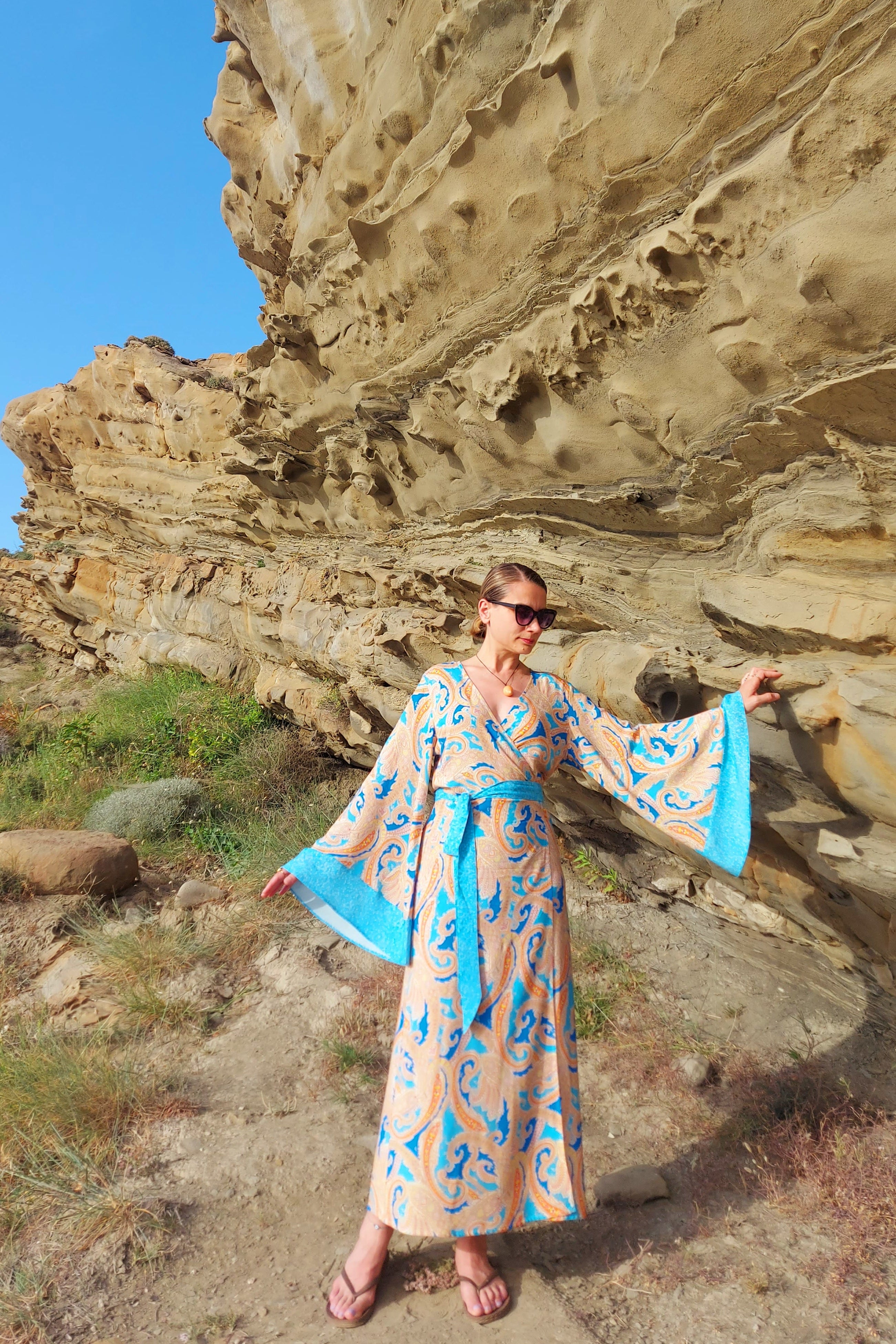 Despina viscose kimono dress in a natural coastal setting