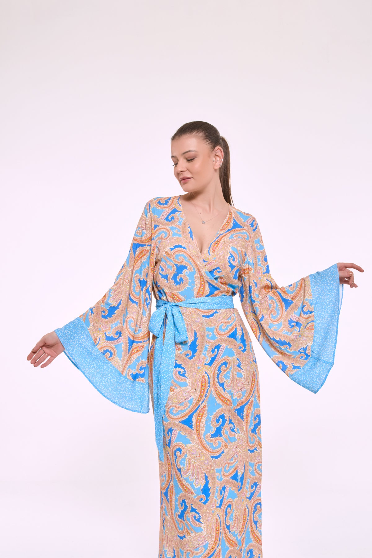 Despina blue kimono dress with wide sleeves in motion