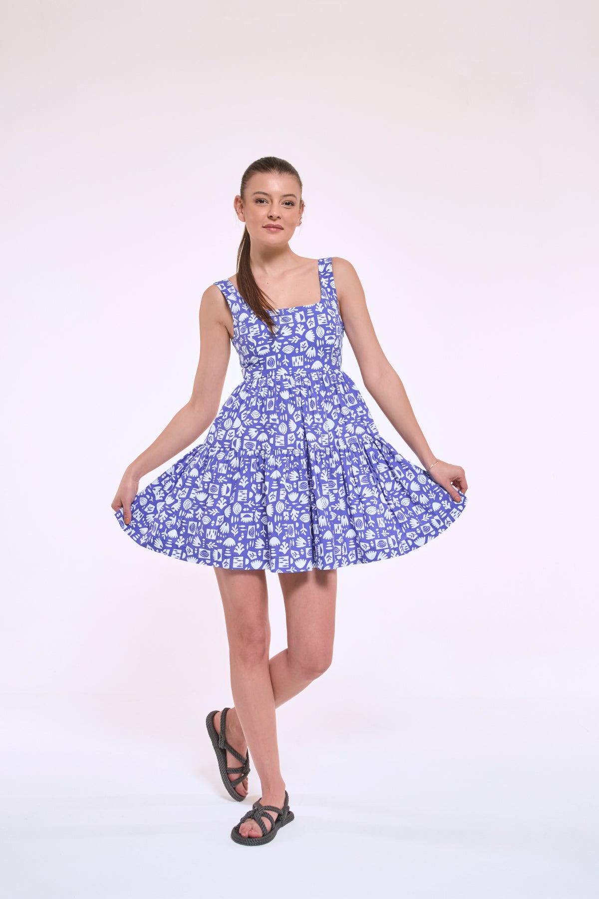 Diana abstract print mini dress with flared skirt in motion