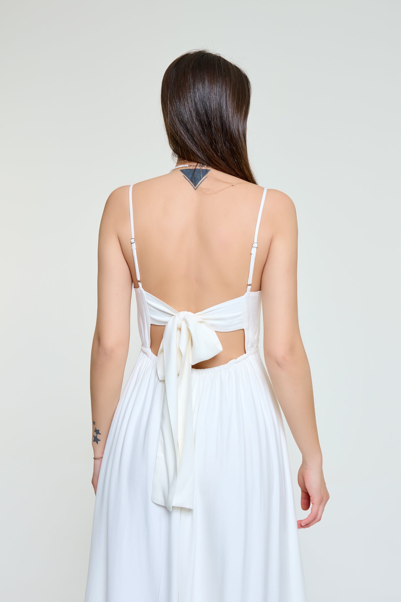 Back detail of Doris white dress with bow tie