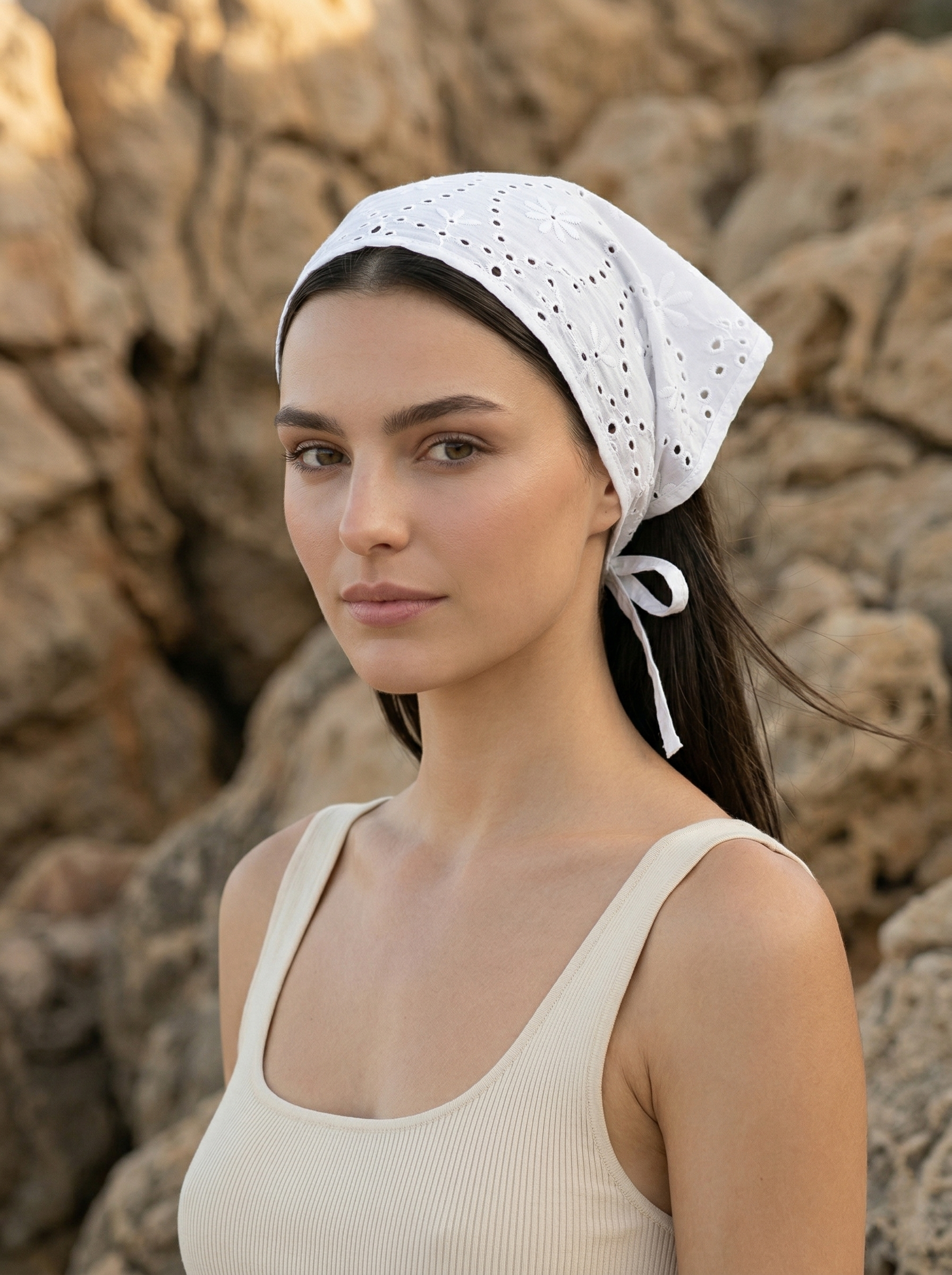 White broderie anglaise bandana styled as headscarf in summer beach look