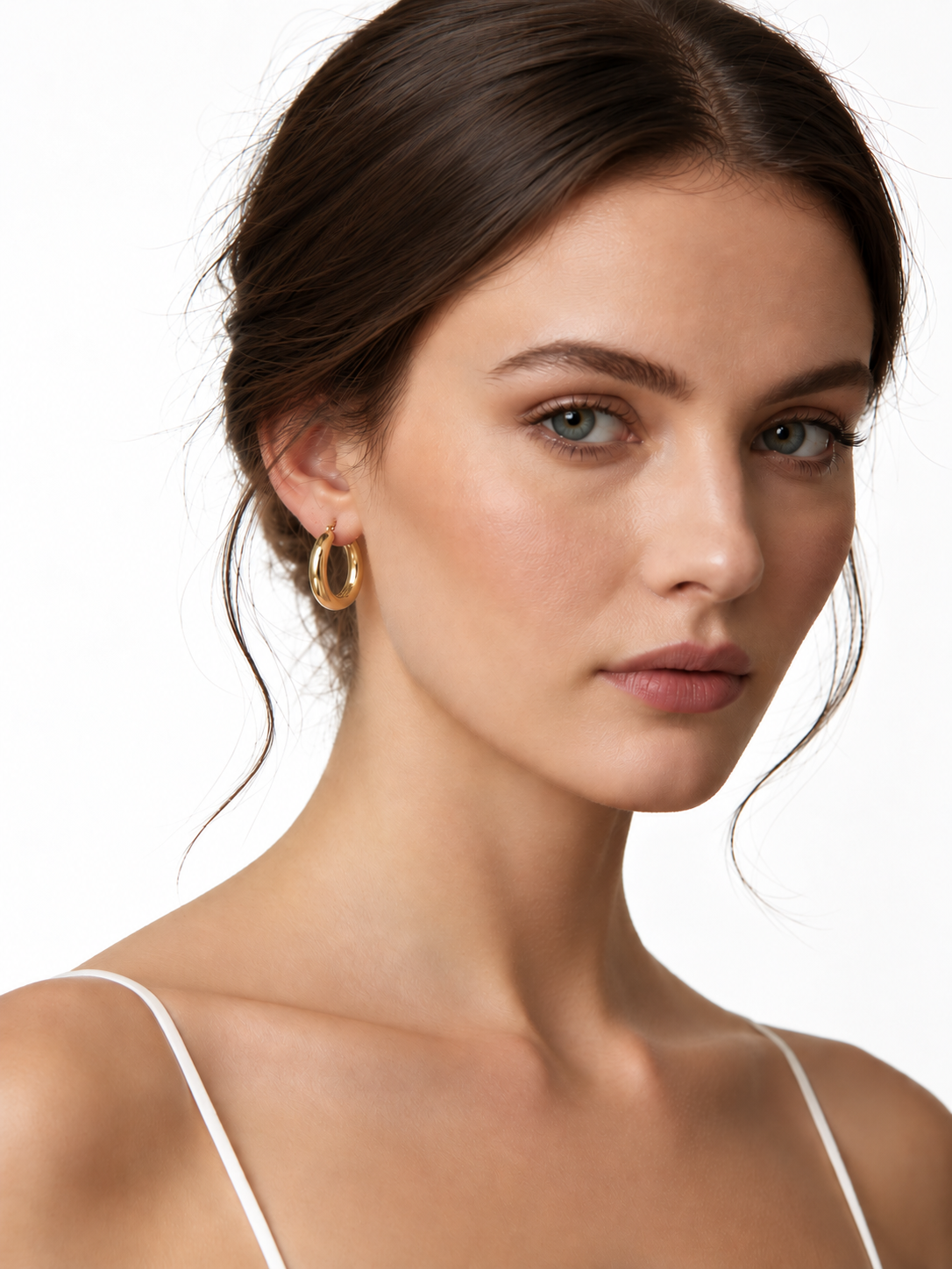 Elegant Gold Hoop Stainless Steel Earrings On A Beauty Portrait