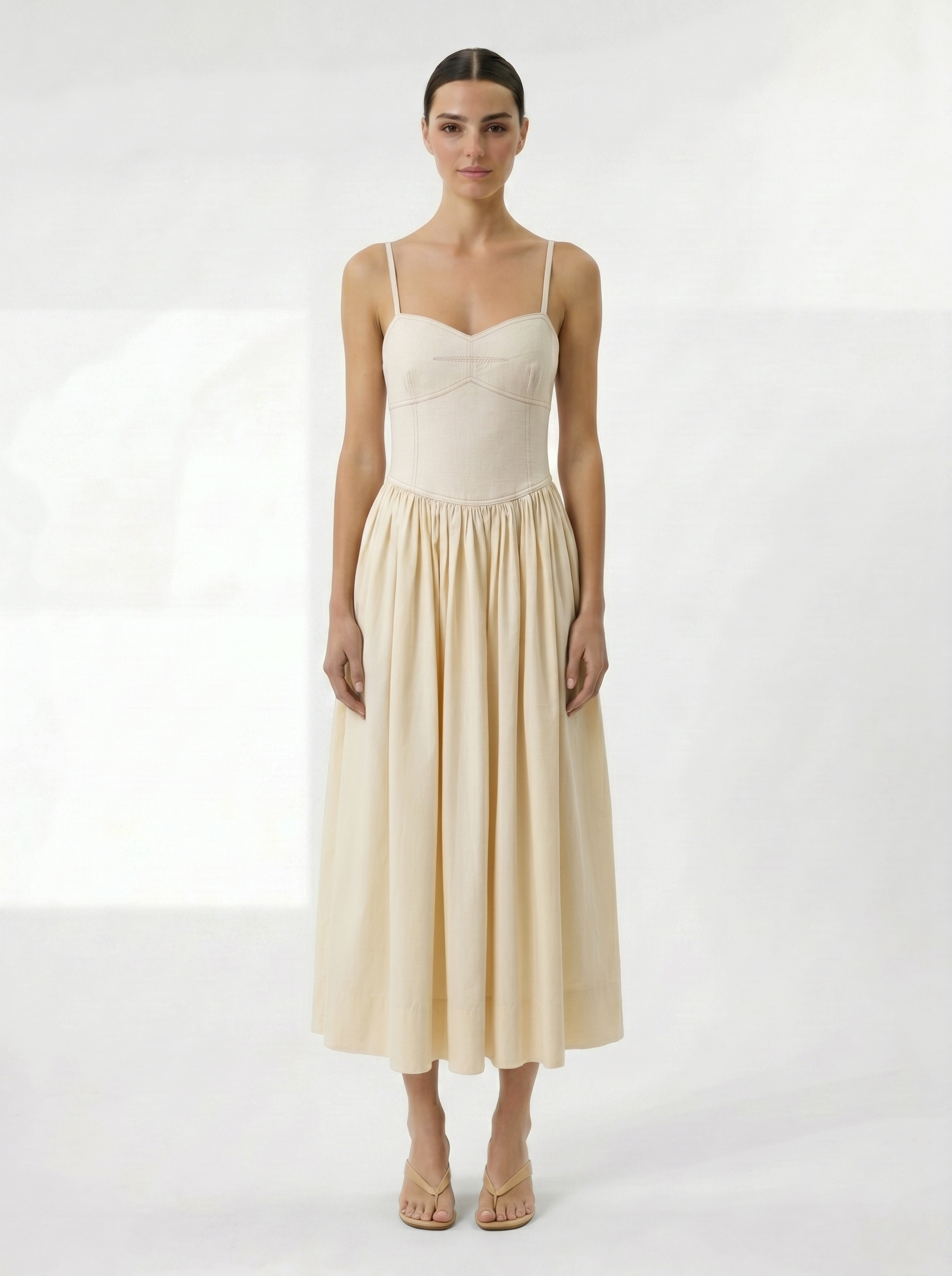 Cream midi dress with corset bodice and voluminous skirt front view