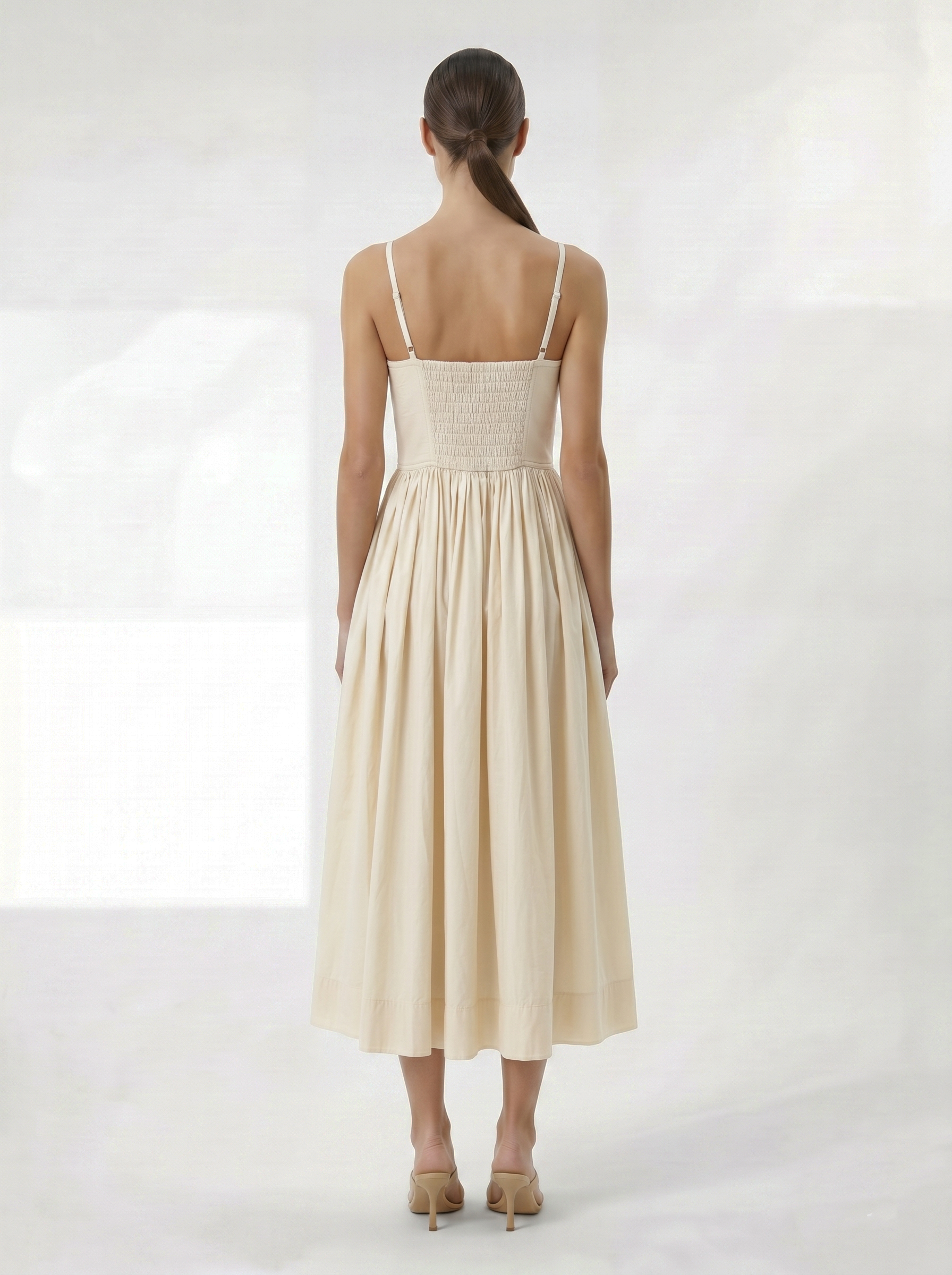 Cream midi dress with smocked back and full skirt back view