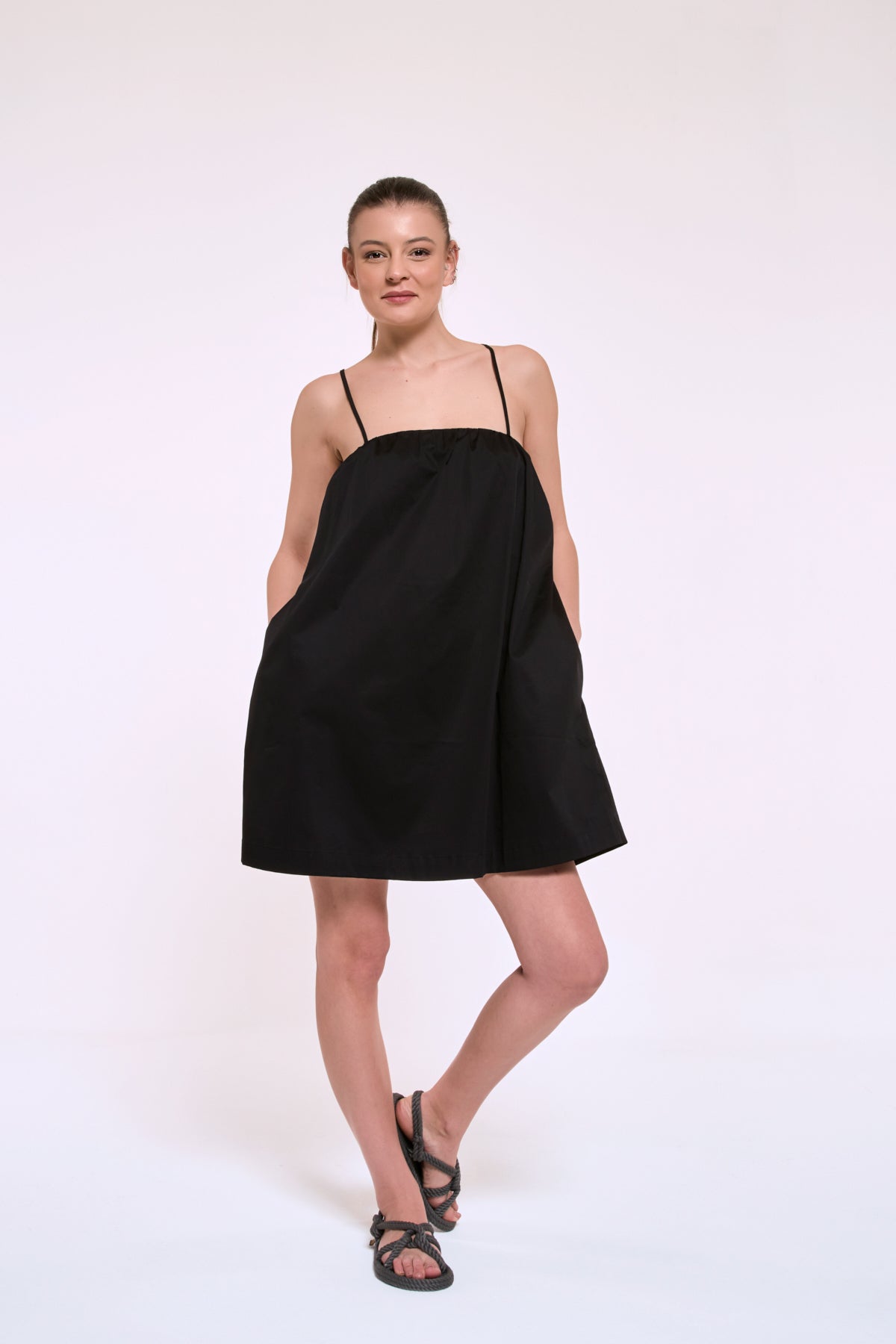 Daisy little black dress with an open back and effortless summer elegance