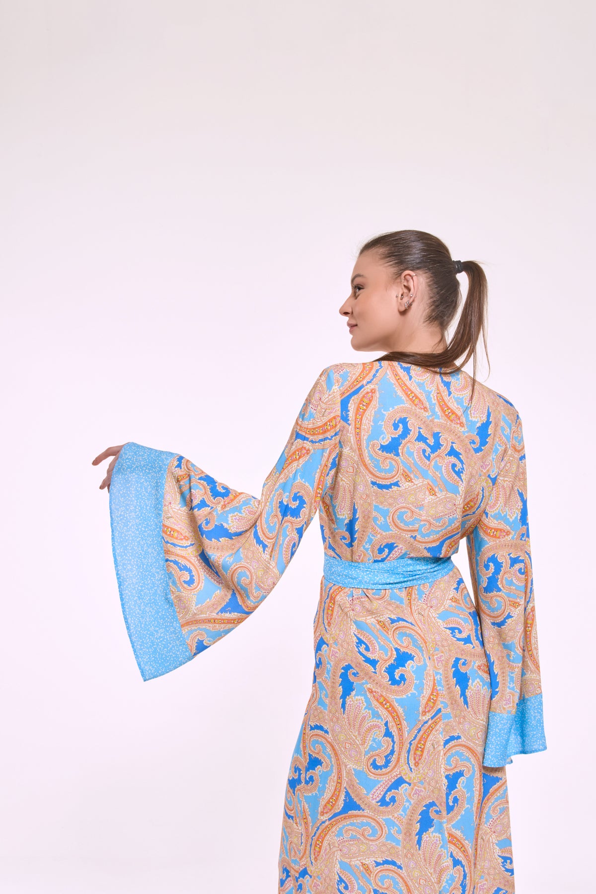Side view of Despina kimono dress with flowing sleeves