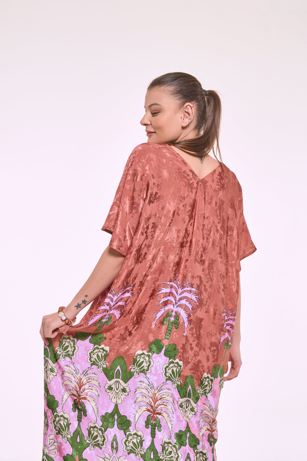 Side view of Dharma exotic print kaftan dress