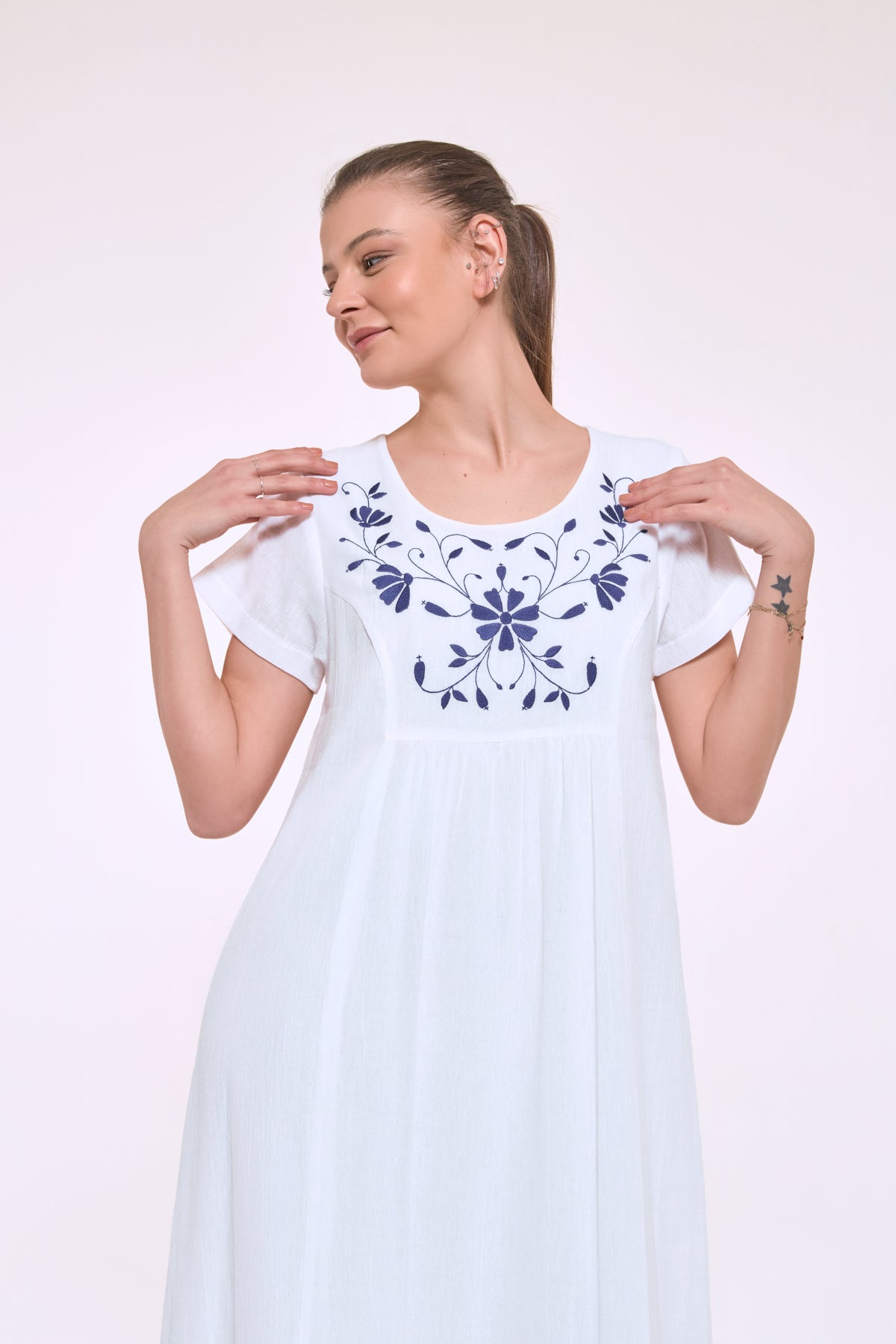 Embroidered neckline detail of Didi white cotton dress
