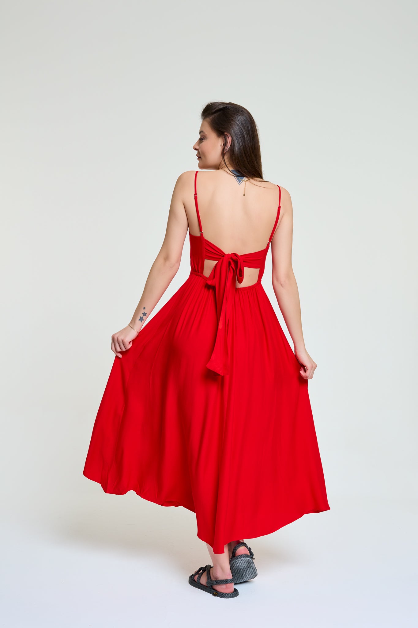 Doris red long dress walking from the back
