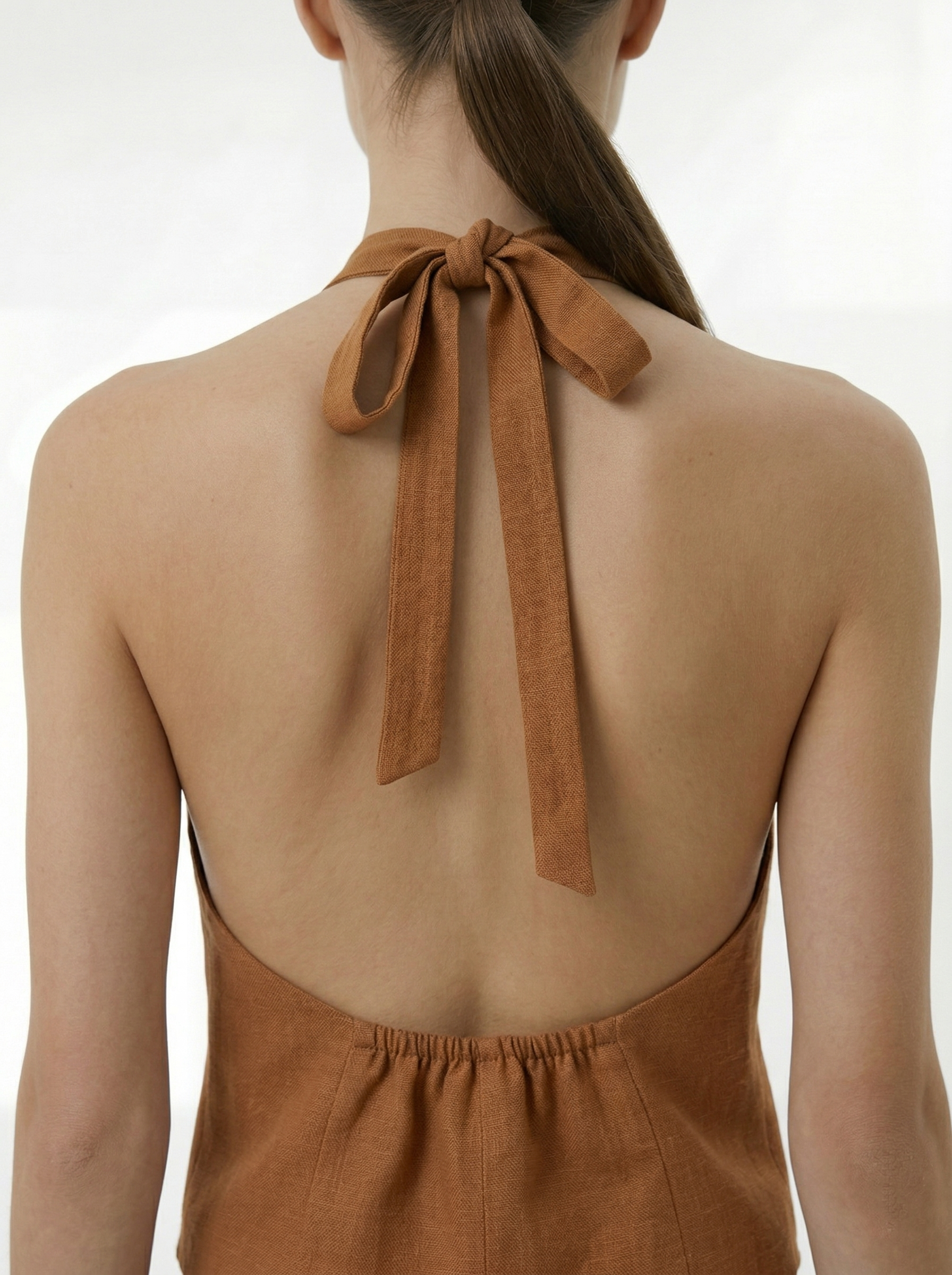 Sally cinnamon brown backless vest bow tie detail close up at back