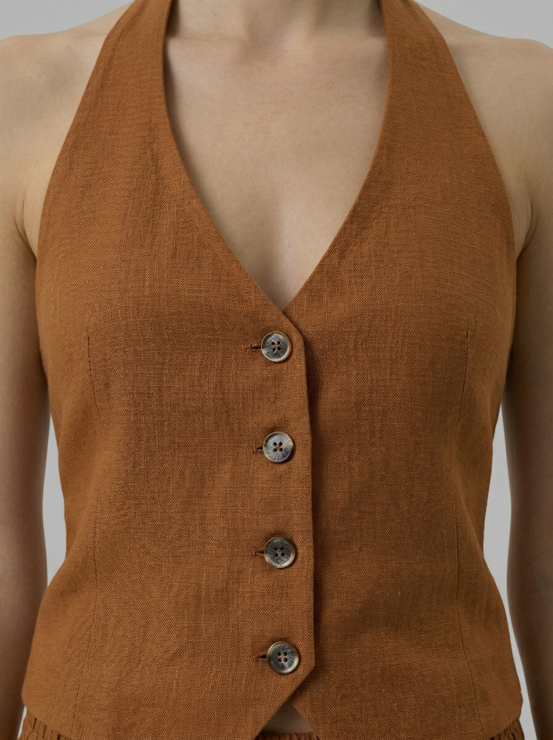 Sally cinnamon brown linen blend backless vest front view button detail