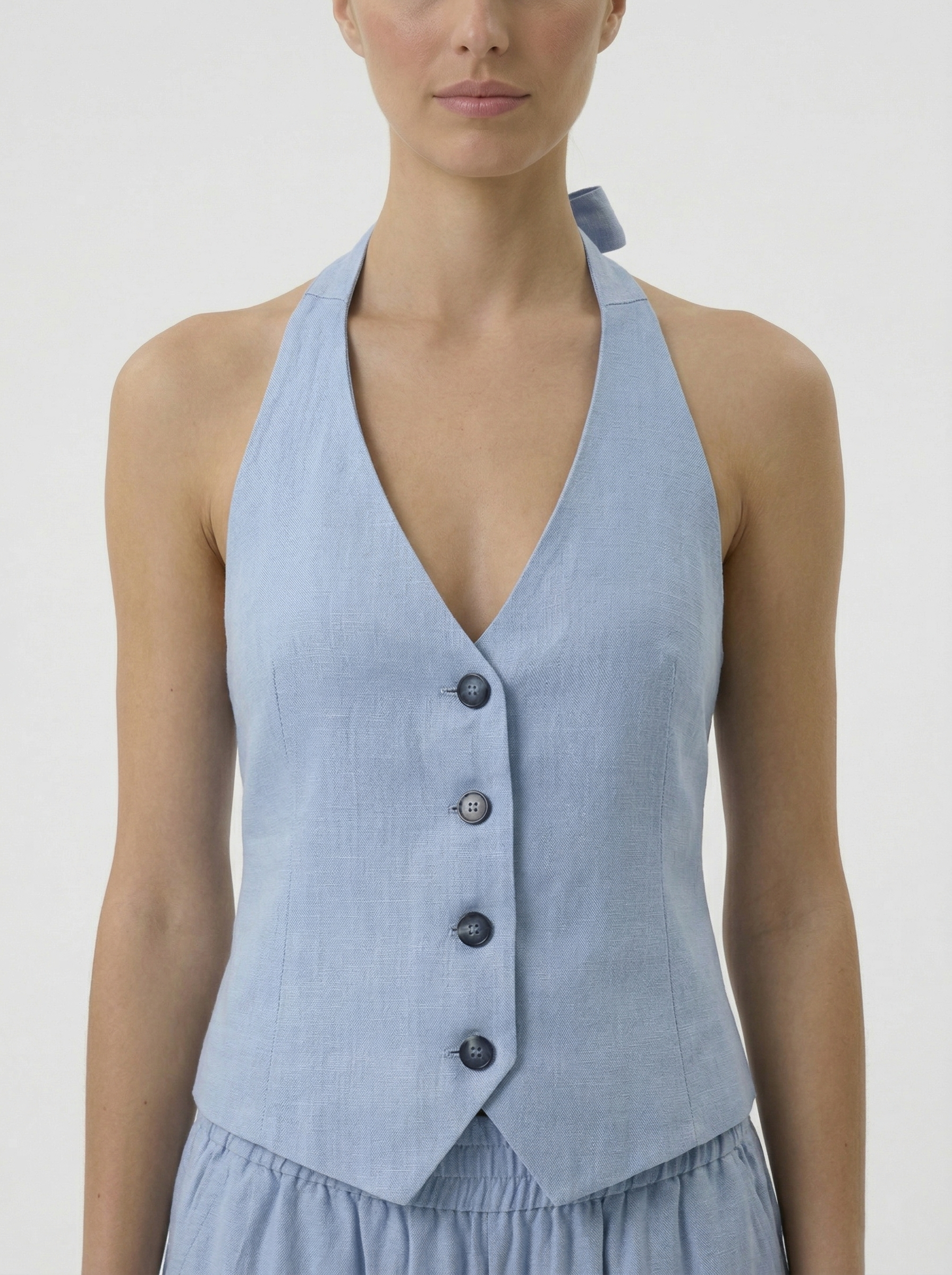 Sally ice blue linen blend backless vest front view button detail
