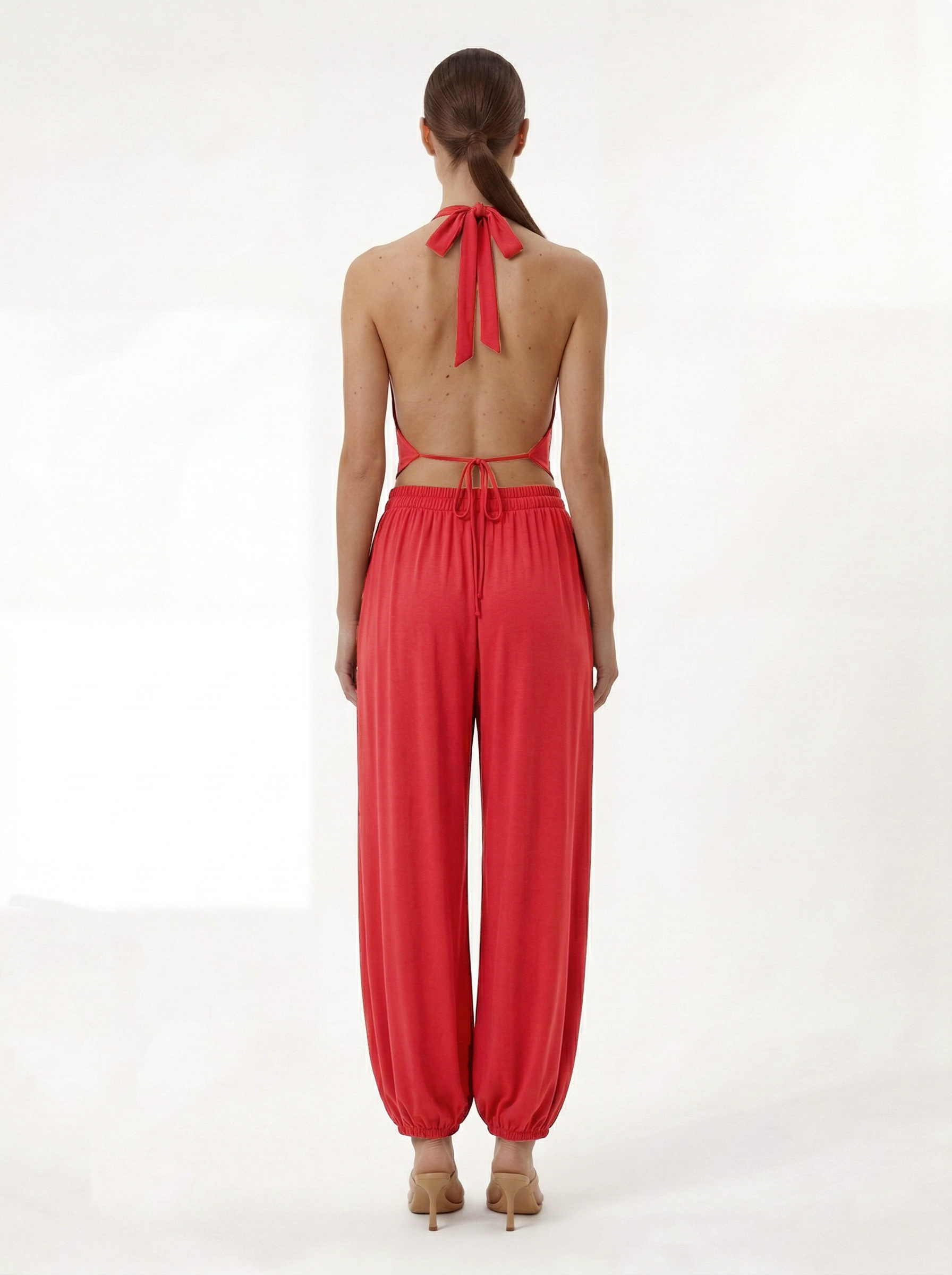 Red modal harem pants styled with halter crop top matching set